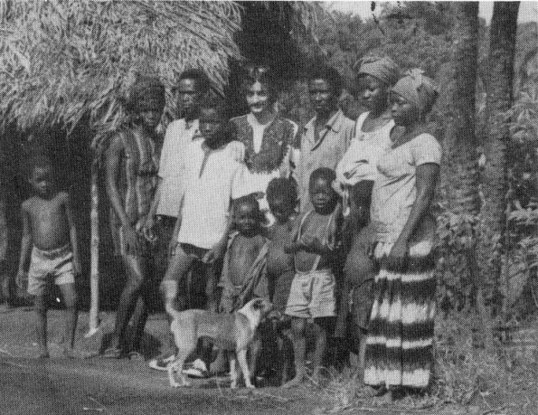 Bob Heavner with villagers and a native dog in Sierra Leone, West Africa