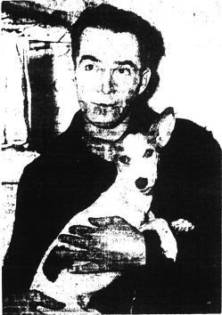 Joe Williams, a fireman aboard the West Lashaway, holding Congo at the Army Base